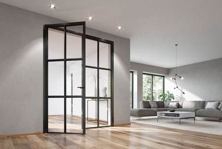 Helles Wohnzimmer mit geöffneter schwarzer Glasdrehtür im Industrial-Look, Parkettboden und moderner Sitzecke.